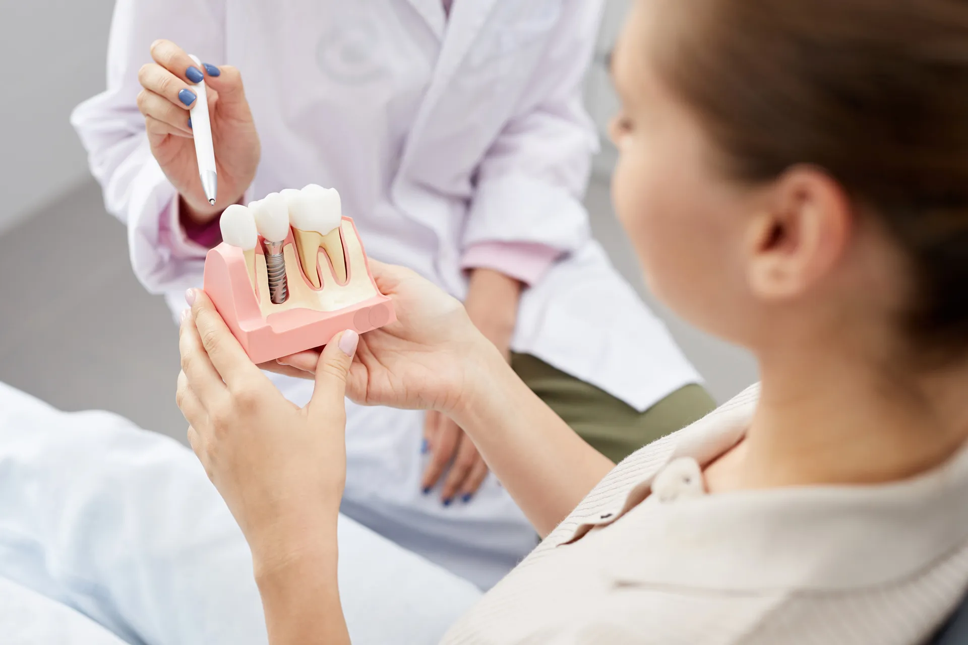 An Implant Dentist Compares Dentures, Dental Bridges, and Implants